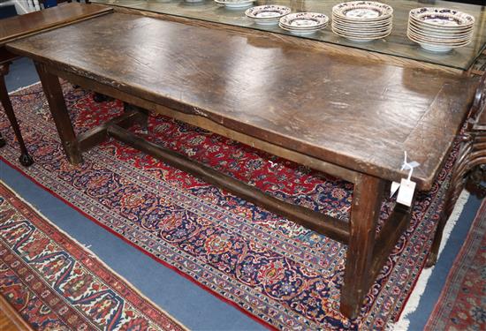 A walnut and oak refectory table W.216cm